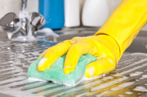 Technician removing stains from upholstered furniture